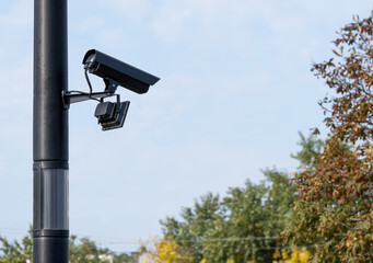 Modern CCTV security system on sky background Smart camera theft protection.