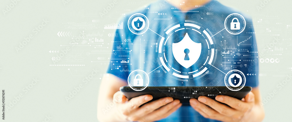 Aufkleber cyber security theme with young man using a tablet computer