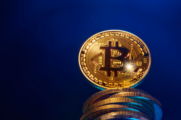 a gold coin bitcoin stands on a stack of coins and flies up, the growth of bitcoin