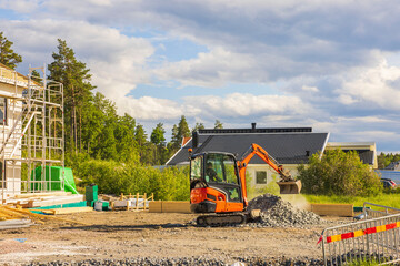 View of work of excavator on construction of house for external work. Sweden. 