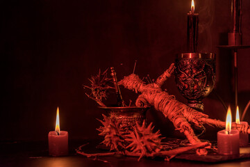 Voodoo Doll on a wooden background with dramatic lighting.