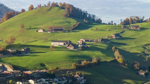 Time lapse, hilly rural landscape with pastures and grazing animals. Ennetmoos, canton of Nidwalden in Switzerland.