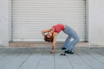girl practicing modern urban dance in the street