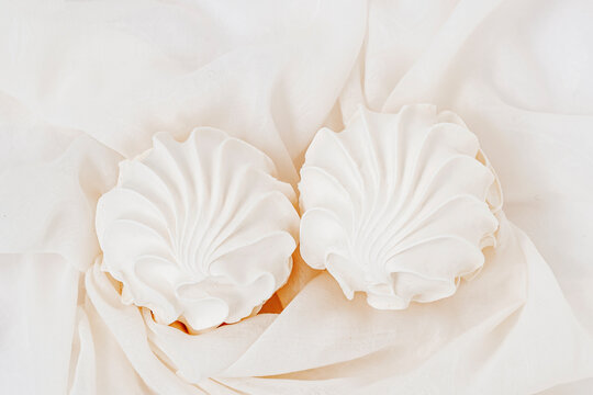 Homemade Meringue or marshmallow on light background. Healthy sweets