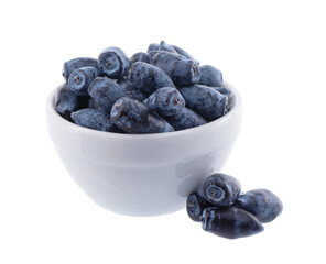 Honeysuckle berries white ceramic bowl, isolated on white background. Ripe berries of honeysuckle. Clipping path.