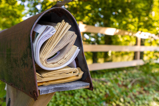 Newspapers Stuffed Into Mailbox