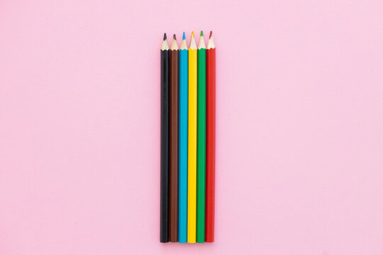 colorful colored pencil on pink background