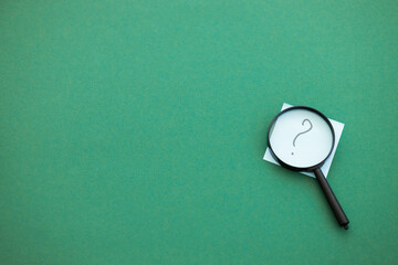 magnifying glass on green background. Search concept