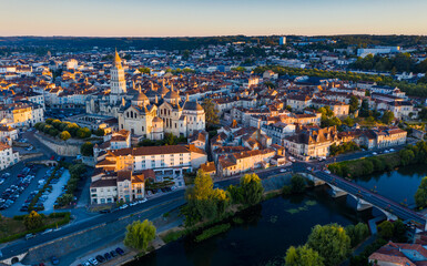 Fototapeta na wymiar View from drone of houses and ancient Catholic Cathedral of Perigueux town at summer daybreak, France