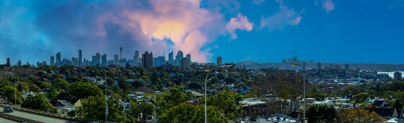 Panorama view of Sydney CBD and Sydney Harbour. Distant view of High-rise office towers and high-rise apartment buildings. Suburban Sydney Suburbs in the foreground NSW Australia  