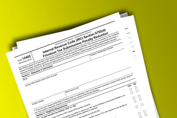 Obraz premium Form 14402 documentation published IRS USA 11.29.2012. American tax document on colored