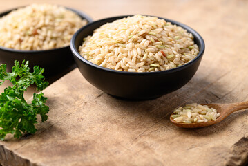 Thai brown rice grain in bowl, Organic rice, Healthy food ingredients