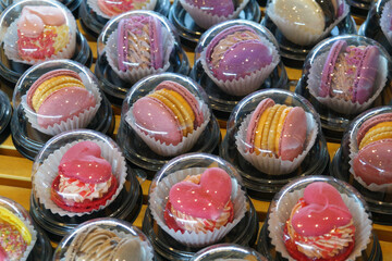 Individually wrapped macarons in round caps