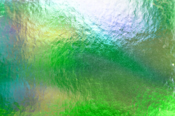Green metallic holographic iridescent shiny foil texture background
