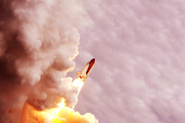 Launch of a space shuttle into space. Elements of this image furnished by NASA