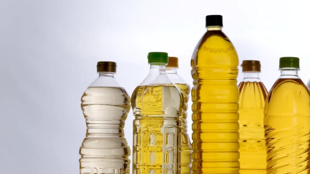 Group of different plants oil bottles for cooking isolated on white background, slider shots
