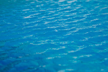 Obraz premium surface of water, blue wave background 