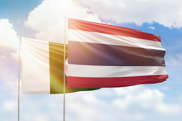 Sunny blue sky and flags of thailand and pakistan