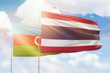 Sunny blue sky and flags of thailand and azerbaijan