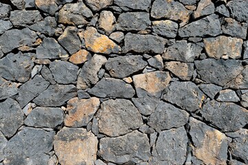 Pared de piedra del volcán el Teide de la isla de Tenerife, con diferentes texturas y colores
