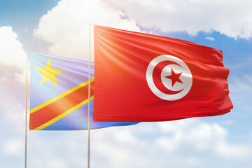 Sunny blue sky and flags of tunisia and dr congo