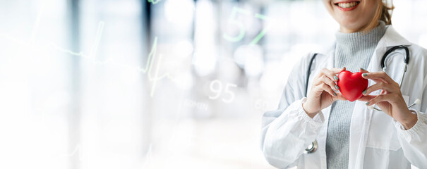 Female doctor holding red heart, medical health care and doctor staff service concept.