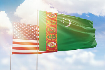 Sunny blue sky and flags of turkmenistan and usa - obrazy, fototapety, plakaty
