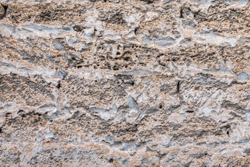 Detail of stone texture for background. Surface of the marble with brown tint