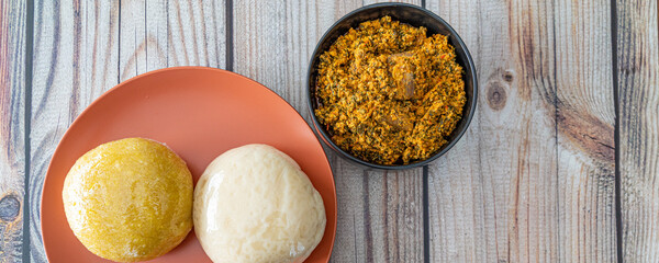 Pounded Yam and Garri Eba served with Egusi Soup