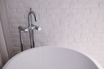 hydrant shower with bathtub in bathroom