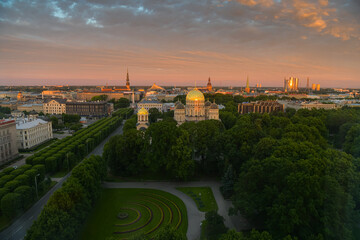 Amazing summer sunrise over the central district of Riga, with view to Freedom Monument, Old town and Cathedral. Landmarks of Latvia.