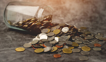 Money coins, lots of savings in a glass jar, close-up photo of money money saving concept