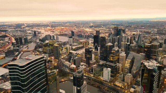 Aerial drone view of Melbourne City Victoria, Australia heading in the direction of Port Phillip looking over Yarra River in the early morning 