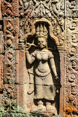 A sandstone carving of Apsara with the solemn face of Phra Khan Temple, Angkor Wat, Siem Reap, Cambodia