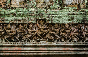 Sandstone carvings on the door sill depicting Apsara ladies dancing at the Phra Khan Temple, Angkor Wat, Siem Reap, Cambodia.
