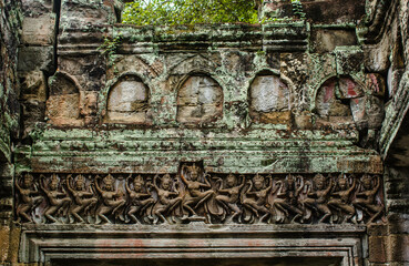 Sandstone carvings on the door sill depicting Apsara ladies dancing at the Phra Khan Temple, Angkor Wat, Siem Reap, Cambodia.