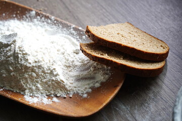 Kazakhstani tenge is lying on the table with scattered flour.
