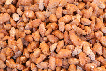 caramelized sugar coated roasted almonds for sale in candy shop