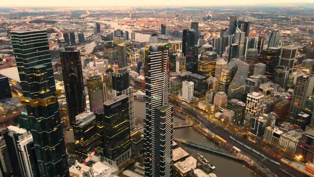 Aerial drone pullback view of Melbourne City, Victoria, Australia above Yarra River in the early morning 