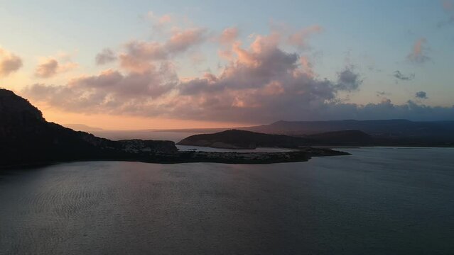 Panoramic aerial view of voidokilia beach, one of the best beaches in Europe. Beautiful lagoon of Voidokilia from a high point of view at sunset in Messinia, Greece, Europe
