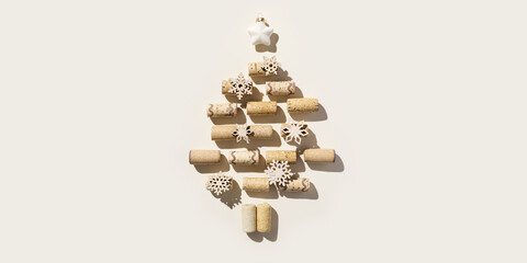 Wine corks as Christmas Tree on beige background, sun shadows. Wooden bottle stoppers as xmas, New Year decoration. Minimal Christmas flatlay, Happy New Year card, pastel neutral, design menu