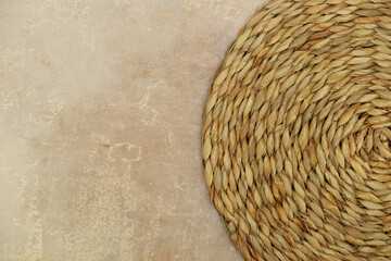 Dried Grass Straw Circular Woven Matt on Vintage Worn Background