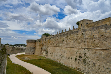 Fototapeta na wymiar The towers and walls of an Aragonese castle that defended the city of Otranto from pirate attack, Italy.