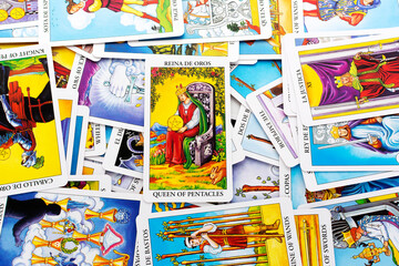 Kyiv, Ukraine - May 22, 2022 : Tarot cards, Rider Waite tarot cards,the queen of pentacles isolated card in the foreground.
