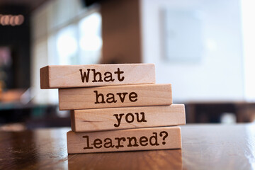 Wooden blocks with words 'What have you learned?'. - obrazy, fototapety, plakaty