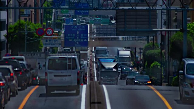 A timelapse of the traffic jam at the urban street in Tokyo long shot panning