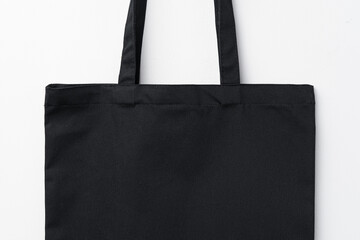 Empty fabric shopping bag on white background