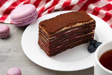 Slice of homemade chocolate honey cake on plate