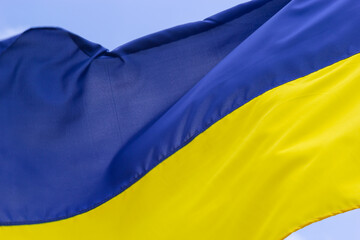 Ukraine flag isolated on the blue sky with clipping path. close up waving flag of Ukraine. flag symbols of Ukraine