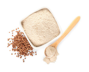 Bowl of flour, spoon and buckwheat grains on white background